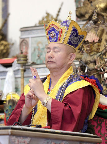 Guru Performs Acala Mudra